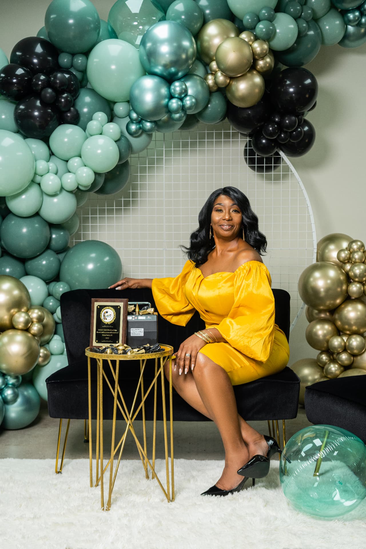 Get It Poppin founder with awards in the brand photo shoot
